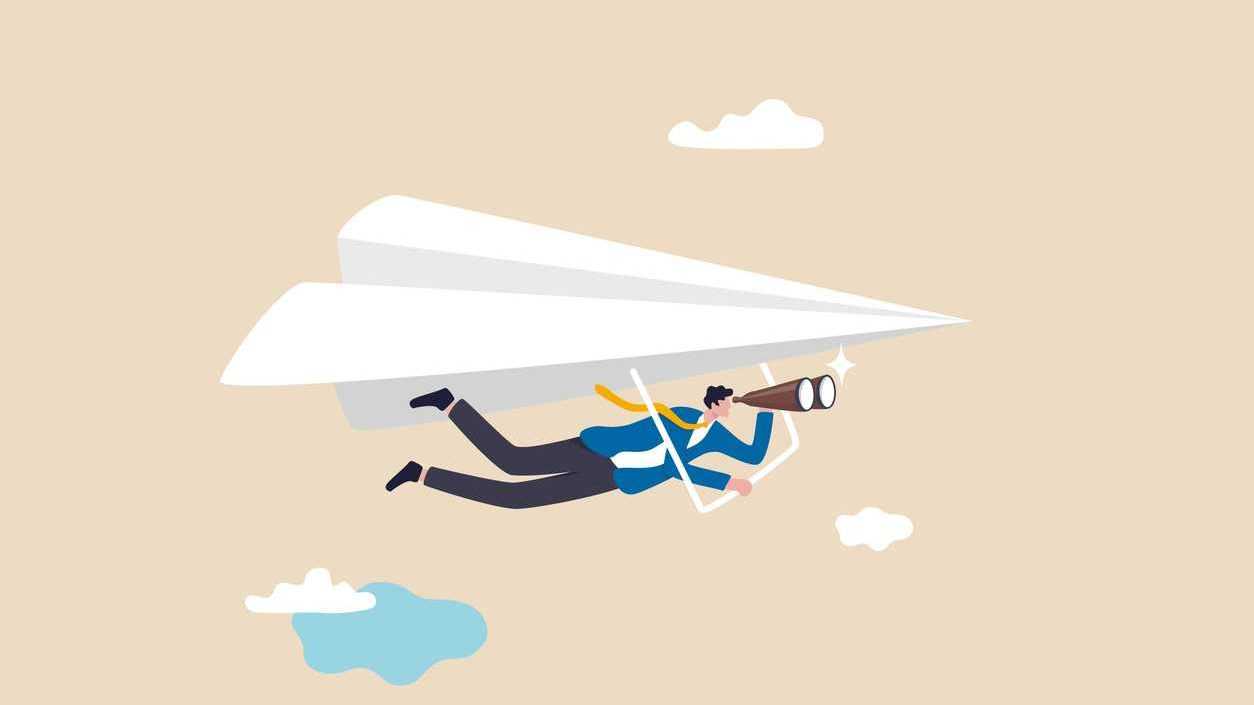 businessman flying paper airplane origami as glider with binoculars
